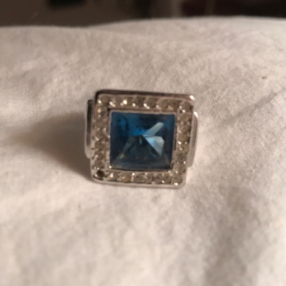 Silver with blue center stone and cubic zirconia